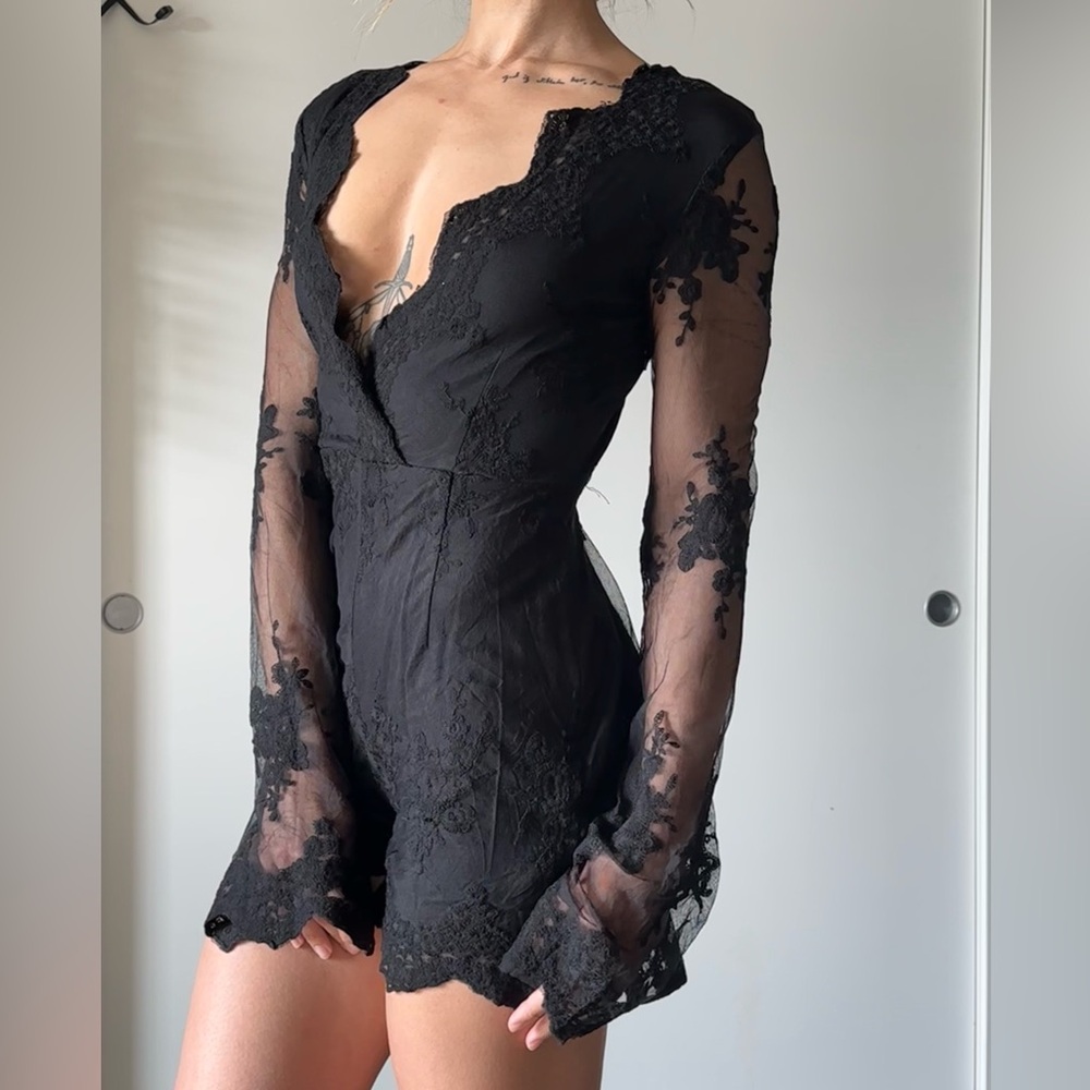 PrettyLittleThing Black Bodycon Romper with Plunge Neckline and Bell Sleeves